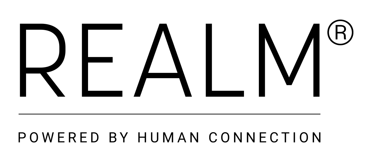 REALM logo: the REALM wordmark set in serif capitals.